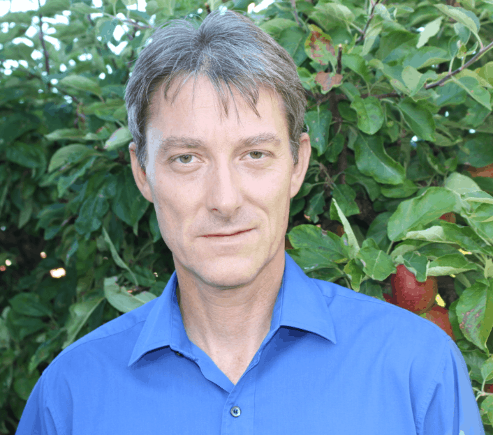 A person in a blue shirt
Description automatically generated