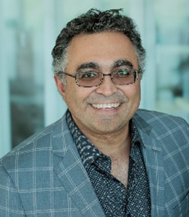 A picture containing person, person, glasses, wearing
Description automatically generated